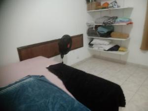 Ένα ή περισσότερα κρεβάτια σε δωμάτιο στο Condomínio Lumar