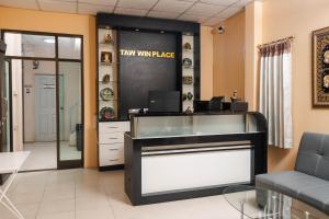 a waiting room at a law wing place with a cash register at Taw Win Place in Chiang Mai