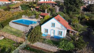 an aerial view of a house with a swimming pool at Lucky Lemons - Boutique Houses Madeira - 2 in Estreito da Calheta