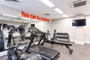 a gym with tread machines and a sign that says you can do anything at For Students Only Vincent Place in Southampton in Southampton