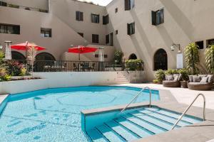 a large swimming pool in front of a building at Costa del Sol Trujillo Centro in Trujillo