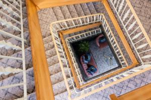 an overhead view of a bed with a mirror at The Monterey Hotel, BW Signature Collection in Saint Helier Jersey