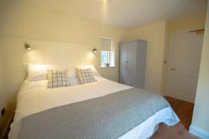 Letto o letti in una camera di The Arch House