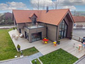 an overhead view of a house with a deck at Chez Watersy in Belle-et-Houllefort