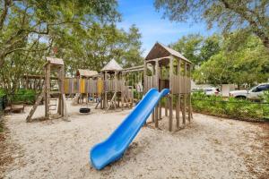 a playground with a blue slide at Brighton Carriage House in Rosemary Beach