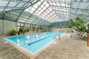 a large swimming pool with a glass ceiling at Brighton Carriage House in Rosemary Beach