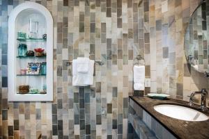 a bathroom with a sink and a mirror at Benoit Cottage in Rosemary Beach +27 photos