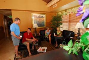a group of people in a living room playing a video game at Sea Crest Oceanfront Resort in Myrtle Beach