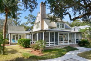 a white house with a chimney at 3 Bedroom Wilson Village Home 19 in Bluffton