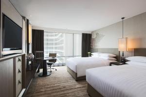 Giường trong phòng chung tại Bangkok Marriott Marquis Queens Park +169 ảnh
