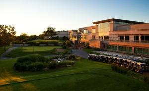an aerial view of a building with a green yard at Eaglewood Resort & Spa in Itasca