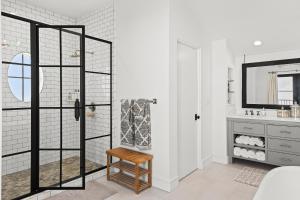 a bathroom with a shower and a sink at Oasis Cottage & Carriage House in Rosemary Beach +48 photos