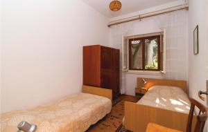 Postel nebo postele na pokoji v ubytování Apartment Supetar 49