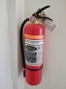 a red fire hydrant is attached to a wall at JMC1 Room1 Tagbilaran City Bohol in Tagbilaran City