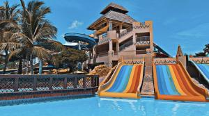 a resort with a slide and a water park at Beachfront Apartment with Pool & Stunning View in Salalah +29 photos