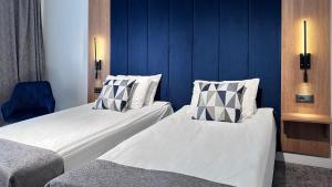 Postel nebo postele na pokoji v ubytování Hotel Soimul