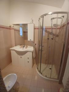 a bathroom with a shower and a sink at Casa Maergilù in Pescara +33 photos