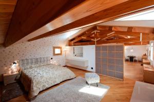 a bedroom with a bed in a room with wooden ceilings at Modica-Apartments in Modica