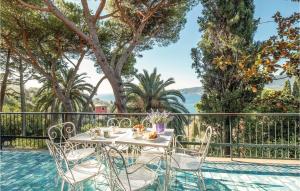 a table and chairs next to a pool at Villa Valentini in San Michele di Pagana