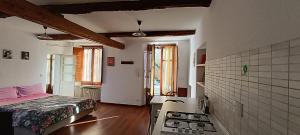 a bedroom with a bed and a sink in it at Del Nobile Apartment II in Turin