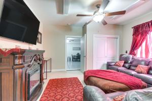 a living room with a couch and a flat screen tv at 10 Mi to Yosemite Lake Atwater Retreat in Atwater
