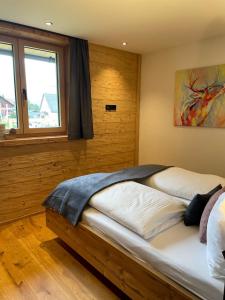 Postel nebo postele na pokoji v ubytování Rosa Alpina Appartement