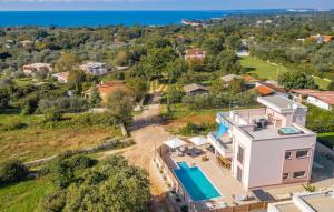 an aerial view of a house with a swimming pool at Villa Karizma - sea view, swimming pool, hot tub, Brijuni, Fazana, Peroj in Peroj
