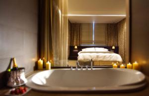 A bed or beds in a room at Philippos Xenia Hotel