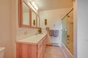 a bathroom with a sink and a shower at On-Site Kenai River Fishing Soldotna Apartment! in Soldotna +23 photos