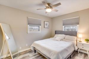 a bedroom with a bed and a ceiling fan at Andover Bungalow - Sleeps 6 in Andover