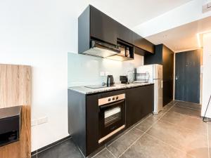 Η κουζίνα ή μικρή κουζίνα στο Rocha Square Monoambiente Temporario +6 φωτογραφίες