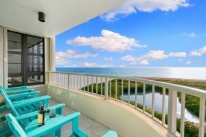 a balcony with chairs and a view of the ocean at La Bella Vita on Marco - 1812 South Seas Tower 3 in Marco Island