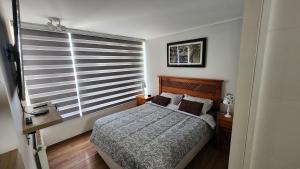 Postel nebo postele na pokoji v ubytování Laguna del mar La Serena. departamento + 49 fotografií