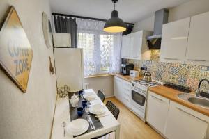 Kuchyňa alebo kuchynka v ubytovaní Apartament Dzień Dobry 2