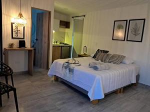 Postel nebo postele na pokoji v ubytování Cabaña Los Pinos