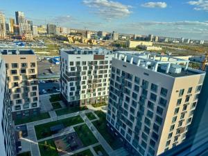 an aerial view of a large building in a city at Nexpo City уютные апартаменты возле ЭКСПО in Prigorodnyy