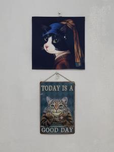 a sign that says today is a good day at Catio Apartments in Panglao