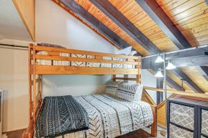 a bedroom with a bunk bed in a loft at Brian Head Condo Walk to Giant Steps Ski Lifts! in Brian Head