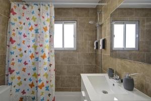 a bathroom with a shower curtain with stars on it at Comeback SWEET HOME CALAHONDA in Calahonda +25 photos