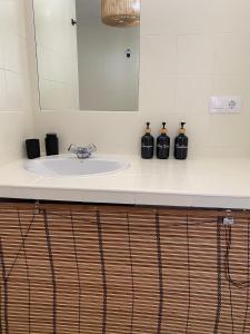 a bathroom counter with a sink and a mirror at Loft Mojacar Neptuno in Mojácar +7 photos