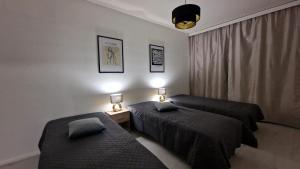 Postel nebo postele na pokoji v ubytování Villa Ruths Stay Palmu