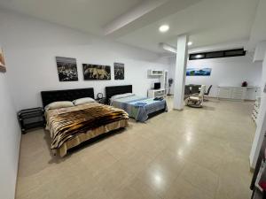 a bedroom with two beds in a room at Apartamento el rebalaje VI in Roquetas de Mar