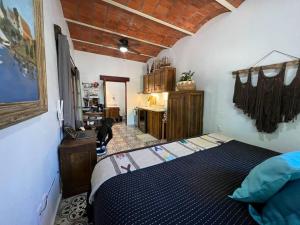 a bedroom with a bed in a room at PRIVATE OASIS! New Casita with Parking, Garden and Outdoor Kitchen! in Lo de Marcos