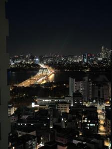 a view of a city at night at Healing House in Seoul