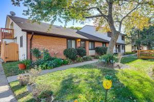 a house with a yard with a tree at Walk to Parks and Dining Quaint Alexandria Condo! in Alexandria