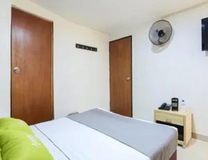 Postel nebo postele na pokoji v ubytování Hotel Colombia Avenida