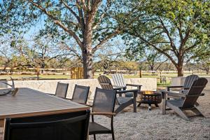a group of chairs and a table and a fire pit at Relaxing Hill Country Home with Outdoor Fire Pit in Waring