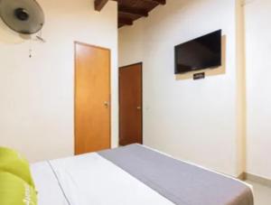 TV a/nebo společenská místnost v ubytování Hotel Colombia Avenida