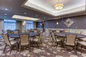 a meeting room with tables and chairs in a room at Drury Inn & Suites Cleveland Beachwood in Beachwood