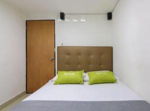 Postel nebo postele na pokoji v ubytování Hotel Colombia Avenida